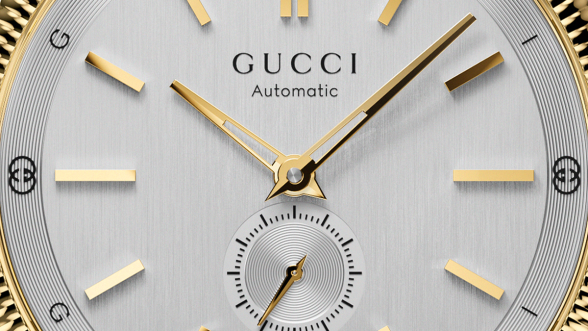 Gucci silver dial with a yellow-gold-plated bezel and gold galvanized indexes and hands © Gucci