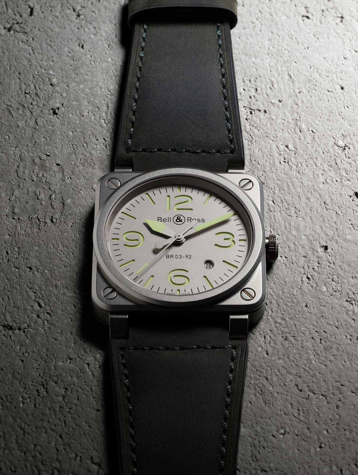 La BR 03-92 Horolum is worn on a grey-green calfskin and ultra-resistant black synthetic fabric strap.