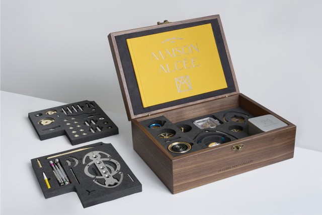 Nostromo clock with display case showing mechanical movement