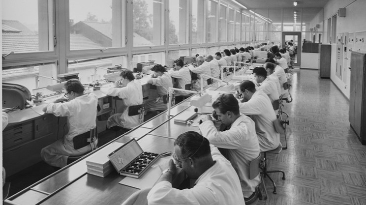 Universal Genève watchmakers working in te factory - 1960s © Breitling