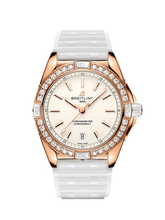 Super Chronomat 38 Origins en or rouge, lunette sertie de diamants de synthèse, cadran argent, mouvement automatique avec date par guichet, bracelet en caoutchouc. CHF 20'500.- © Breitling